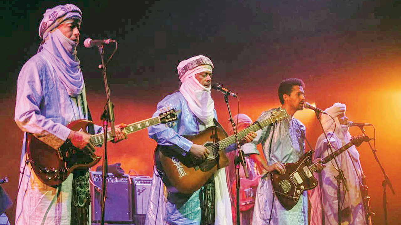 Members of the Tinariwen group in performance. Pic courtesy/@Tinariwen